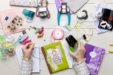 Scrapbooking materials spread out on a table