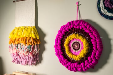 Two hanging weaving projects made on a loom by Sarah Harste Weavings