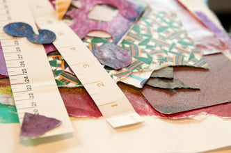 Paper crafter supplies laid out on a table for a project